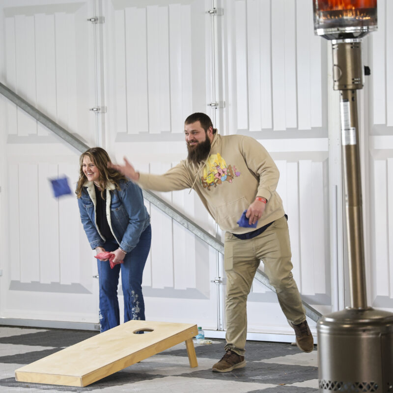 Even guests play cornhole during Corporate event at the NCM Motorsports Park