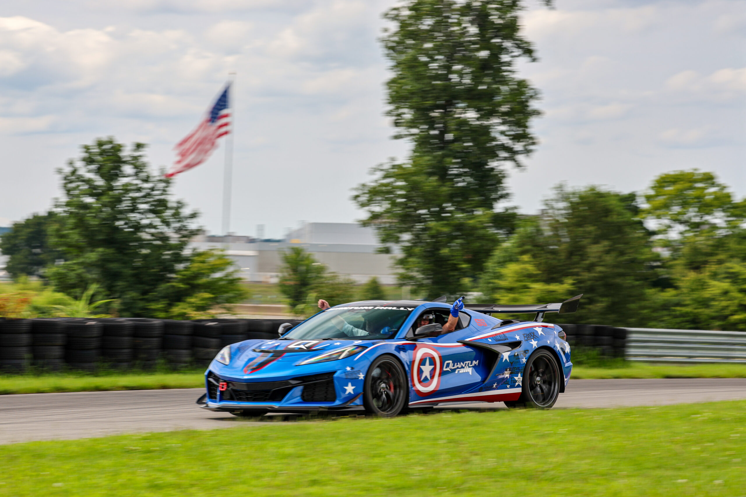 Captain America themed Corvettte flies fast the American Flag on track at NCM Motorsports Park